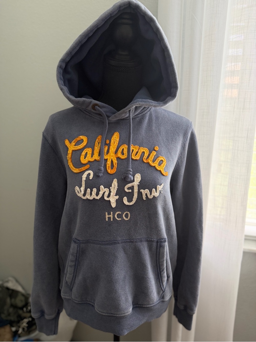 Hollister Navy Hoodie with Cream and Orange Script with logo